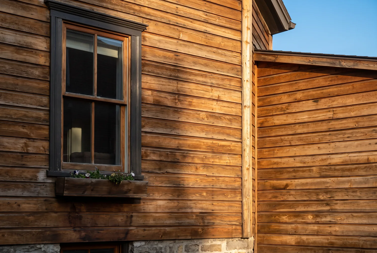 Restored natural wood siding on a Montreal home